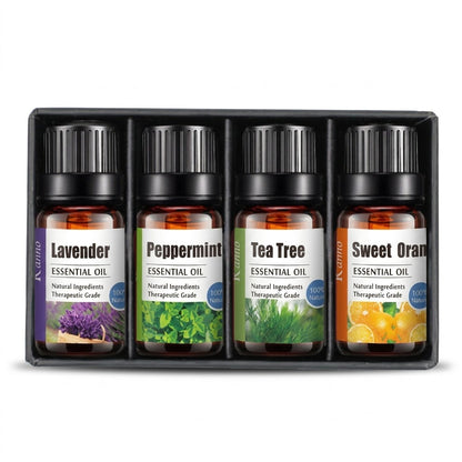 Set of four essential oil bottles in a black box with labels for Lavender, Peppermint, Tea Tree, and Sweet Orange.