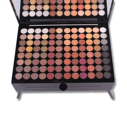 Makeup palette with various shades of eyeshadows on a white background