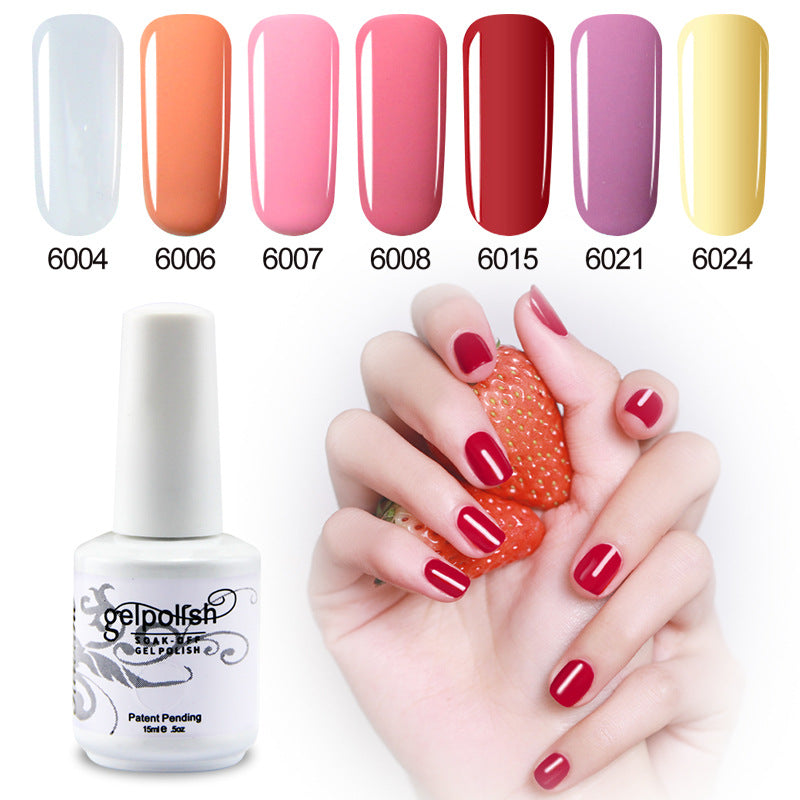 Collection of gel polish colors with a bottle and hand holding a strawberry.
