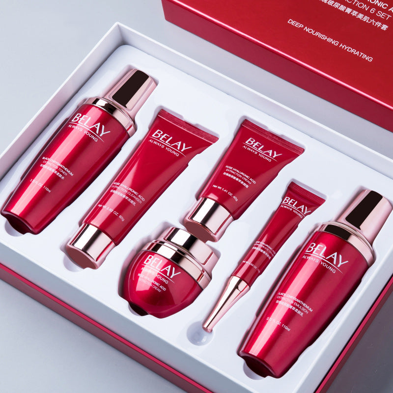 Belay skincare product set with red bottles and tubes in a box